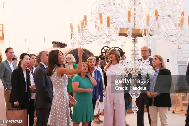 In this handout image provided by the Spanish Royal Household, Queen Letizia of Spain , along with the companions of the leaders of NATO member...