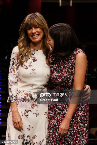 Wife of Spanish Prime Minister Pedro Sanchez, Begoña Gómez , reacts during a visit to the Royal Theater with the companions of the leaders of NATO...