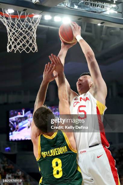 Qi Zhou of China dunks against Matthew Dellavedova of Australia during the FIBA World Cup Asian Qualifier match between the Australia Boomers and...