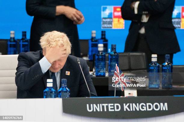 Prime Minister Boris Johnson attends a meeting of the North Atlantic Council with other NATO members during the Nato summit in Madrid, on June 30,...