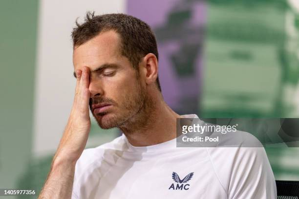 Andy Murray of Great Britain reacts during a press conference following their defeat to John Isner of United States in their Men's Singles Second...