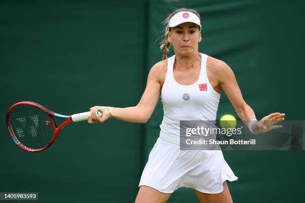 Irina Bara of Romania plays a forehand against Paula Badosa of Spain in their Women's Singles Second Round match on day four of The Championships...