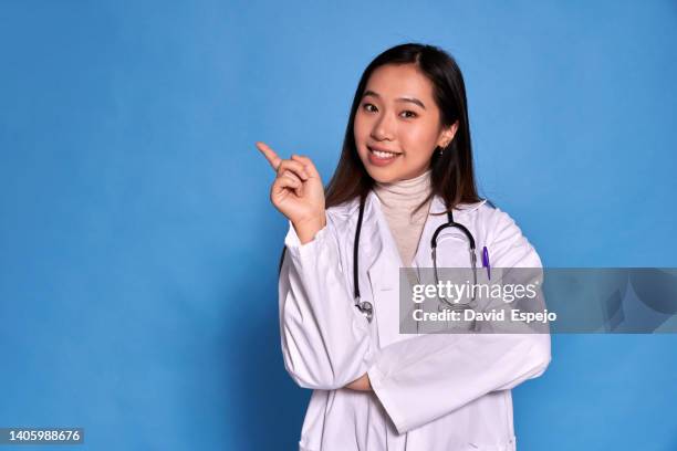 Doctor Point Woman 2,997 Female Doctor Pointing Stock Photos, High-Res Pictures, and ...