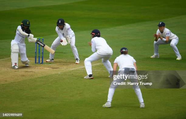 Tumi Sekhukhune of South Africa plays a shot as Amy Jones, Sophia Dunkley, Nat Sciver and Heather Knight of England look on during Day Four of the...