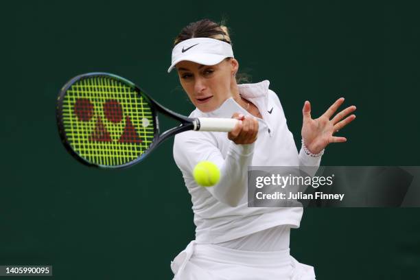 Ana Bogdan of Romania plays a forehand against Petra Kvitova of Czech Republic in their Women's Singles Second Round match on day four of The...