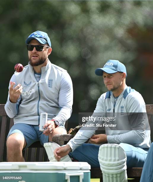 England coach Brendon McCullum chats with batsman Joe Root during nets ahead of the test match between England and India at Edgbaston on June 30,...