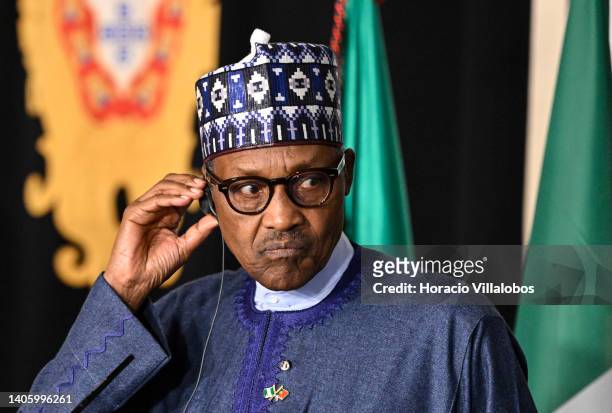 Nigeria's President Muhammadu Buhari listens as Portuguese President Marcelo Rebelo de Sousa delivers remarks to journalists at the end of their...