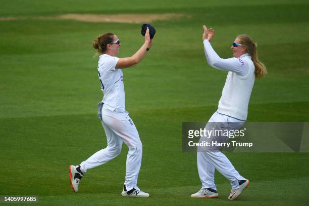 Sophie Ecclestone of England celebrates the wicket of Lizelle Lee of South Africa with team mate Kate Cross during Day Four of the First Test Match...