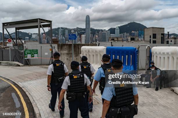 Police officers patrol outside the West Kowloon High Speed Rail Station ahead of President Xi Jinping's arrival on June 30, 2022 in Hong Kong, China....