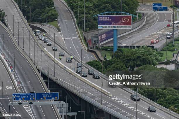 Convoy of Chinese President Xi Jinping drives past flyover as he arrives Hong Kong for the anniversary of the hand over on June 30, 2022 in Hong...