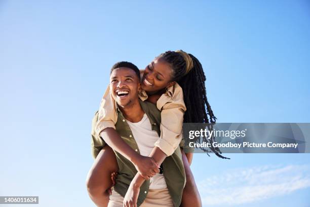 laughing young couple having fun outside in the summertime - couple in love stock pictures, royalty-free photos & images