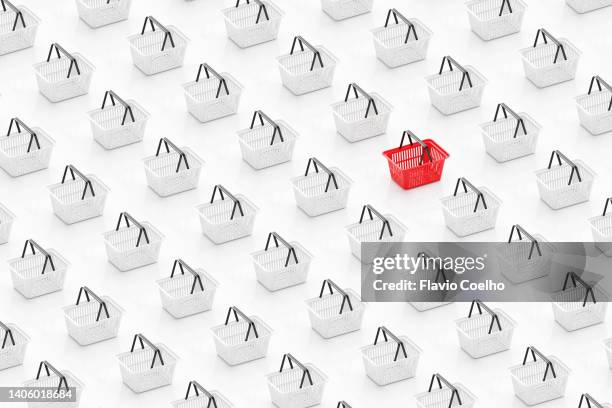 shopping basket standing out from the rest - einkaufswagen freisteller stock-fotos und bilder