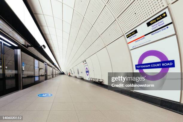 commuters and futuristic architecture on elizabeth line in london, uk - crossrail stock pictures, royalty-free photos & images