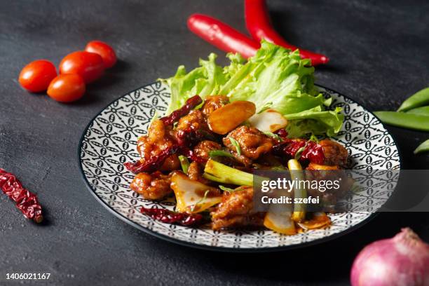 chinese classic dish stir-fried kung pao chicken.  salty, sweet and spicy flavor. - szechuan cuisine stock pictures, royalty-free photos & images