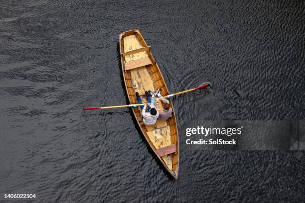 following the flow of the river - rowing boat stock pictures, royalty-free photos & images