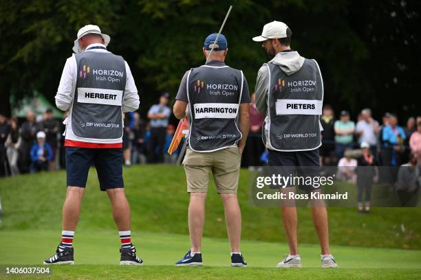 Caddies are pictured on the 14th green during the first round of the Horizon Irish Open at Mount Juliet Estate on June 30, 2022 in Thomastown,...