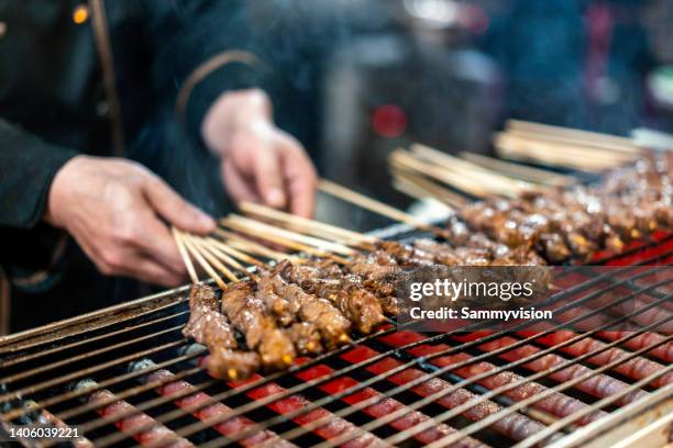 close-up of mutton shashlik on barbecue grill - skewer stock pictures, royalty-free photos & images