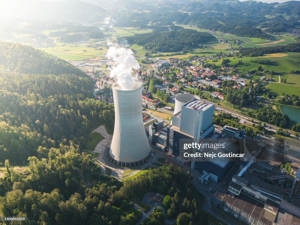 Cooling tower emitting gases from a coal powered thermal power station
