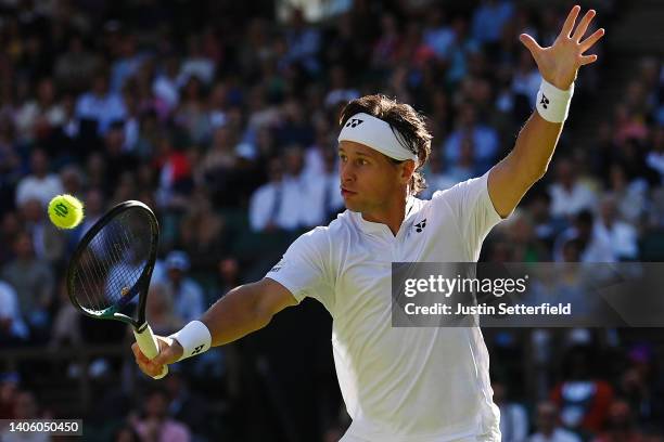 Ricardas Berankis of Lithuania plays a backhand against Rafael Nadal of Spain during their Men's Singles Second Round match on day four of The...