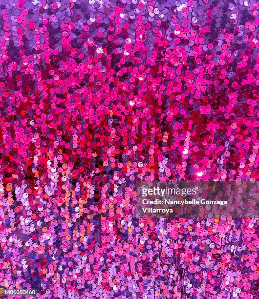 multi shades of pink and purple  sequins on a fabric - sequin stock pictures, royalty-free photos & images