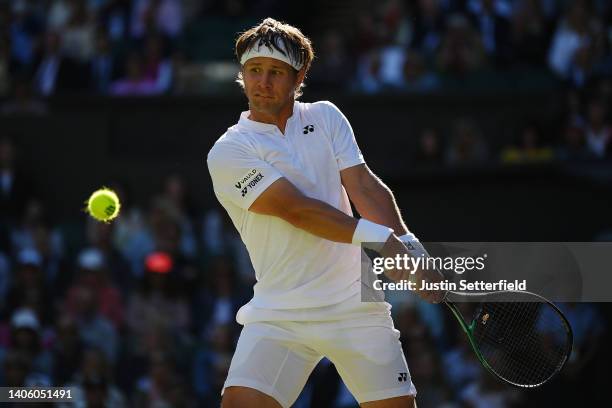 Ricardas Berankis of Lithuania plays a backhand against Rafael Nadal of Spain during their Men's Singles Second Round match on day four of The...