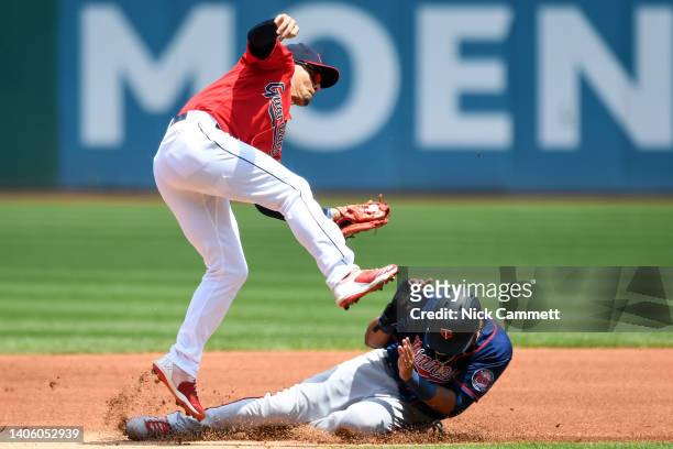 Luis Arráez of the Minnesota Twins is caught stealing second base by Andrés Giménez of the Cleveland Guardians during the first inning at Progressive...