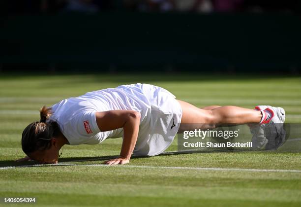 Kirsten Flipkens of Belgium kisses the court, upon their final match, after announcing their retirement from Singles, following their Women's Singles...