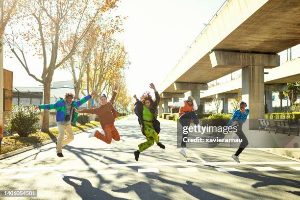 dynamic outdoor portrait of young hip hop dancers - dance music stock pictures, royalty-free photos & images