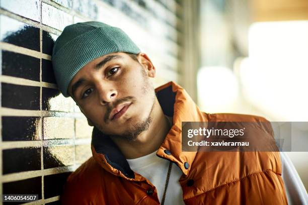 winter portrait of serious young man in barcelona - smart fashion stockfoto's en -beelden