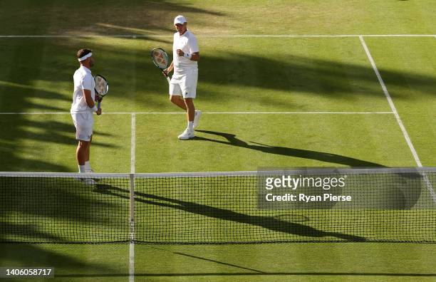 Jonny O'Mara and partner Ken Skupski of Great Britain celebrate a point during their Men's Doubles First Round match against Julio Peralta and...