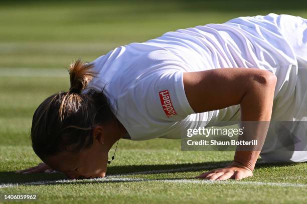 Kirsten Flipkens of Belgium kisses the court, upon their final match, after announcing their retirement from Singles, following their Women's Singles...