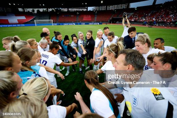 The England team celebrates their side's win as they huddle after the final whistle of the Women's International friendly match between Switzerland...