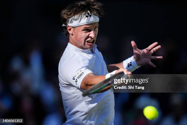 Ricardas Berankis of Lithuania plays a forehand in the Men's Singles Second Round Match against Rafael Nadal of Spain during day four of The...