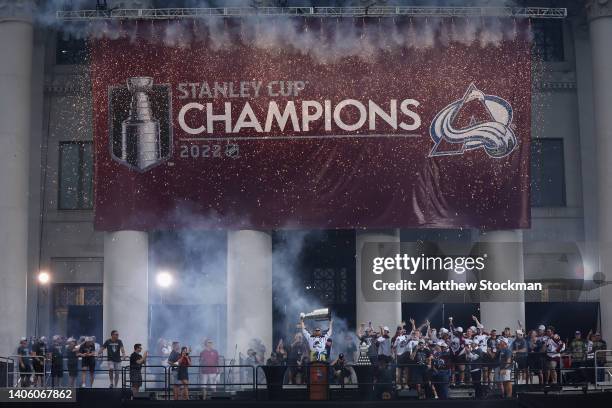Gabriel Landeskog of the Colorado Avalanche lifts the Stanley Cup on-stage during the Colorado Avalanche Victory Parade and Rally at Civic Center...