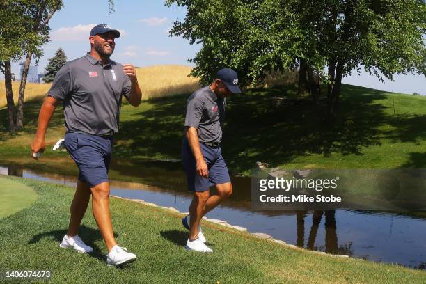 Ben Roethlisberger and John Smoltz walk to the 2nd hole during day one of the ICON Series at Liberty National Golf Club on June 30, 2022 in Jersey...