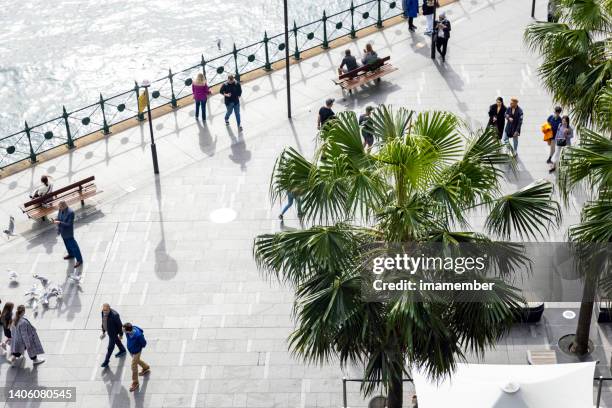 aerial view of people walking on sunny day in city, copy space - sydney harbour people stock pictures, royalty-free photos & images