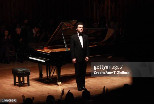 Russian pianist Evgeny Kissin acknowledges the audience as he performs a solo piano recital with works by composers Chopin and Samuel Barber in...