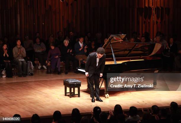 Russian pianist Evgeny Kissin bows as he performs a solo piano recital with works by composers Chopin and Samuel Barber in addition to Beethoven's...