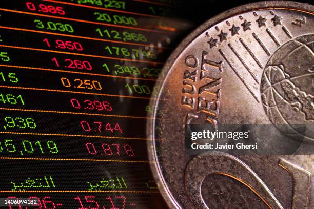 euro currency and stock market - moneta da un euro foto e immagini stock