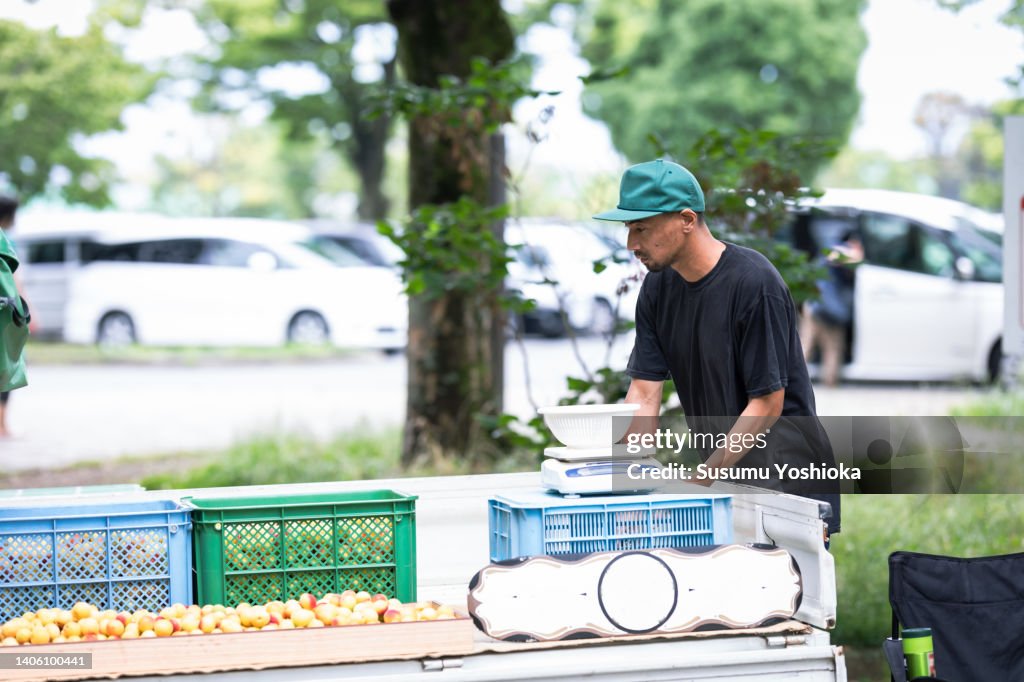 People enjoying shopping at an organic farmers' market.