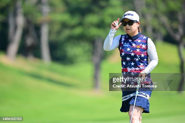 Hiroko Azuma of Japan acknowledges the gallery after the birdie on the 13th green during the second round of Shiseido Ladies Open at Totsuka Country...