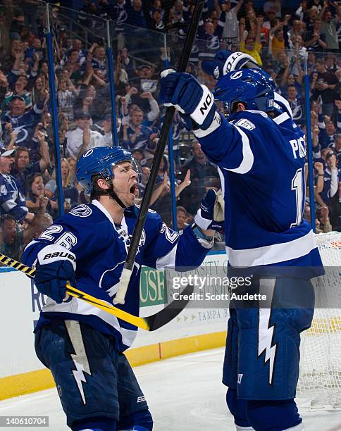 Tom Pyatt of the Tampa Bay Lightning celebrates his goal with teammate Martin St. Louis during the third period against the New York Rangers at the...