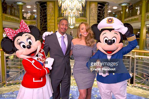 In this handout image provided by Disney Parks, Mariah Carey and Nick Cannon are joined by Mickey Mouse and Minnie Mouse aboard the newest ship of...