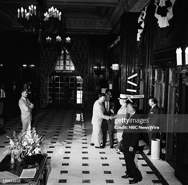 Pictured: NBC News' Paul Cunningham, NBC News' Joe Michaels greet Former President of the United States Harry S. Truman in the lobby of the Sheraton...