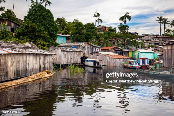 a local fishing village on the amazon river. - brazil village stock pictures, royalty-free photos & images