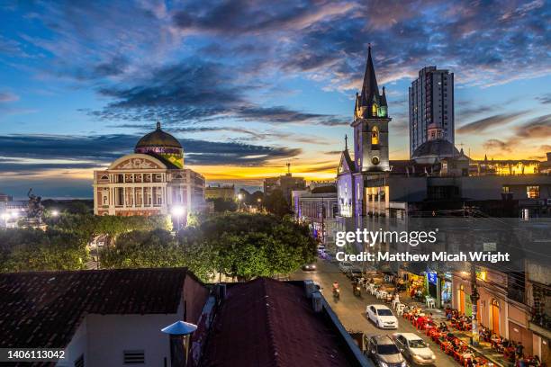 views over the city skyline of manaus at night. the famed amazon theater opera house is the gem of the city. - theater performance outdoors stock pictures, royalty-free photos & images