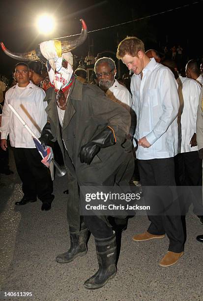 Prince Harry joins in a traditional dance as he takes part in a Jubilee Block Party on March 2, 2012 in Belmopan, Belize. The Prince is visiting...