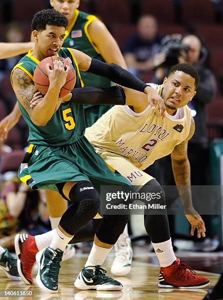 Michael Williams of the San Francisco Dons steals the ball from C.J. Blackwell of the Loyola Marymount Lions during a quarterfinal game of the...