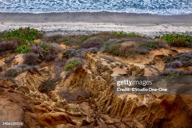 eroding bluff - grooved stock pictures, royalty-free photos & images