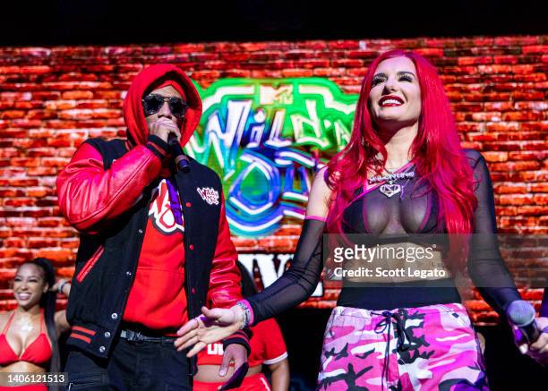 Nick Cannon and Justina Valentine perform onstage during Nick Cannon Presents: MTV Wild 'N Out Live at Pine Knob Music Theatre on June 30, 2022 in...